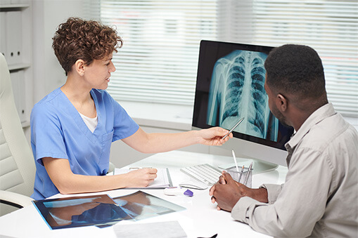 nurse reviewing xrays